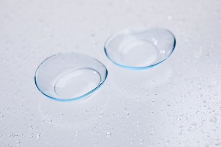 contact lenses on blue background close up viewの写真素材