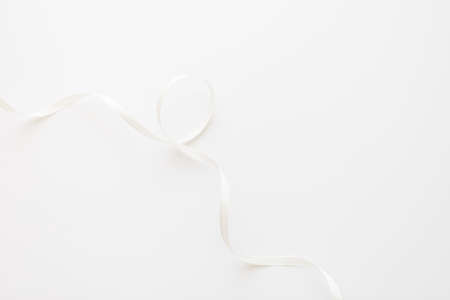 loops of white ribbon on gray text place - Imageの写真素材