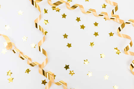 golden confetti on white background flat lay text place - Imageの写真素材