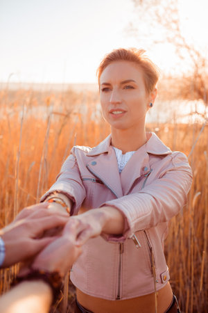 beautiful girl with short hair in the setting sunの写真素材