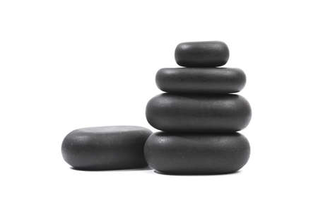 black spa stones isolated on white backgroundの写真素材