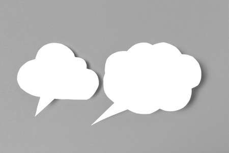 Speech bubbles on color background text fingerの写真素材