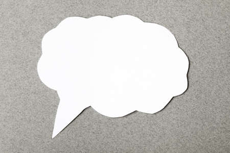 paper speech cloud on gray background