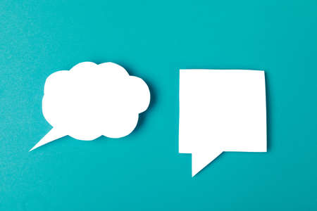 Speech bubbles on color background text fingerの写真素材