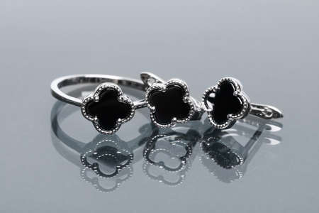 ring and earrings with black enamel composition