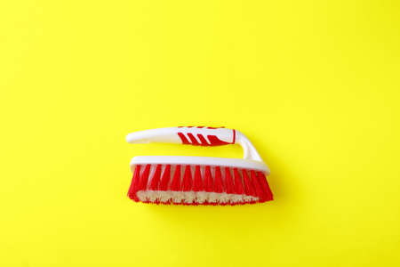 Cleaning brush  on color background. Brush for cleaning clothes, carpets. Tool for home care.の写真素材