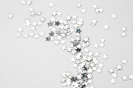 sparkles silver stars on white background with text placeの写真素材