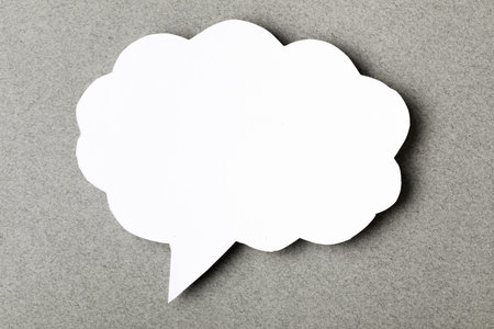 paper speech cloud  on grey backgroundの写真素材
