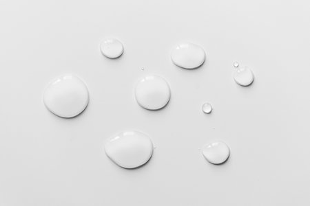 Water drops on white background, top viewの写真素材