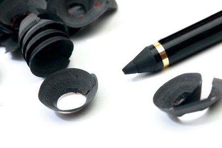 make up pencil shavings isolated on white backgroundの写真素材