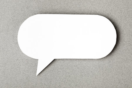 paper speech cloud  on grey backgroundの写真素材