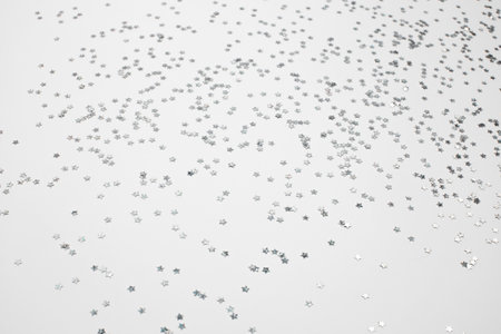 sparkles silver stars on white background with text placeの写真素材