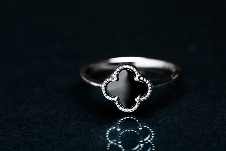 ring with black enamel on black backgroundの写真素材