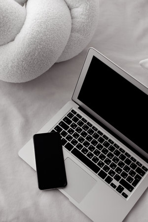 laptop with phone in a modern interior in minimalist styleの写真素材