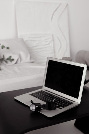 laptop in a modern interior in minimalist styleの写真素材