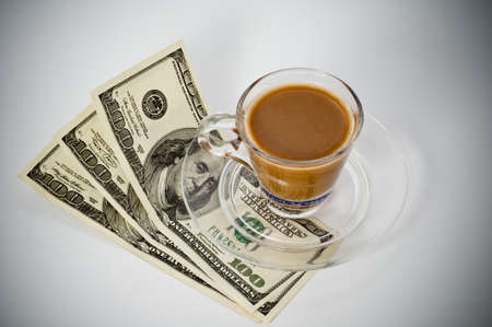 Coffee cup and dollar close upの写真素材