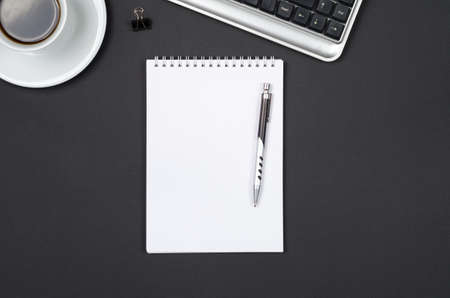 Business items on a black desk.の写真素材
