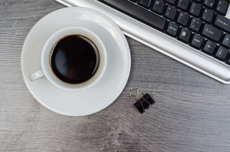 Business items on a wood desk.
