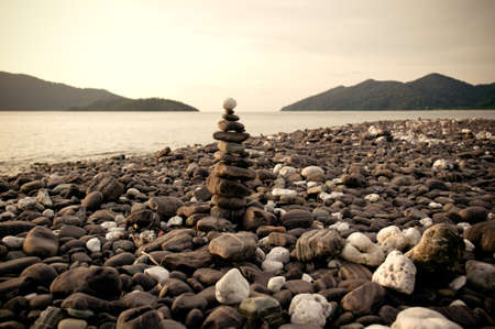Zen meditation background,Balanced stones stack close up on sea beachの写真素材