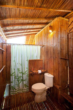 bathroom bamboo with masonry shower cubicle and bathtubのeditorial素材