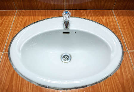 water draining in washbasinの写真素材