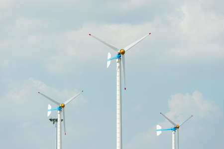 Eco energy - wind turbines ,blue sky background