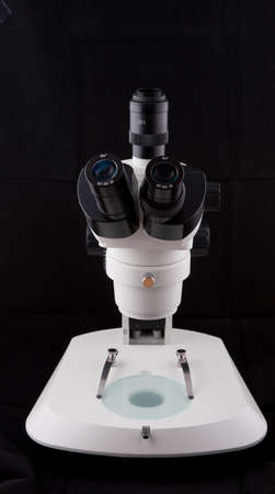 Microscope isolated on white background , This is a genuine piece of equipment that would be used in...