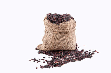 Riceberry rice in sacks on a white backgroundの写真素材