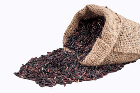 Riceberry rice in sacks on a white backgroundの写真素材
