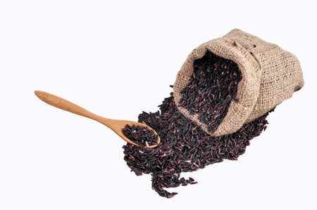 Riceberry rice in sacks top view on a white background.の写真素材