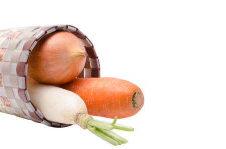Fresh vegetables Raw Carrot,onion,radish in basket isolated on white backgroundの写真素材