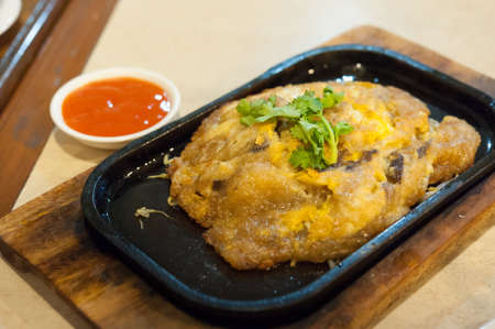 Omelette or Thai-style fried green in a hot pan. / Thailand Food of  Vegetarian , No meat-Made from mushroomの写真素材
