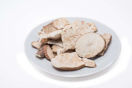 Dried cassava in white plate on the white backgroundの写真素材