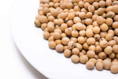 Dried soy beans on white background
