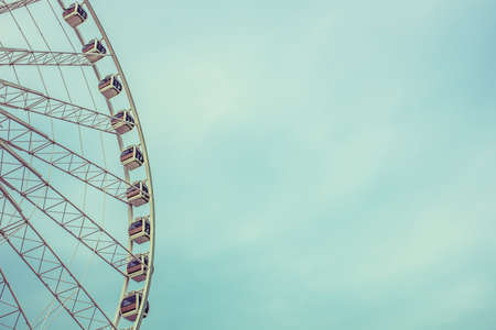 Vintage Retro Ferris Wheel Over Blue Sky in Bangkok,Thailandの写真素材