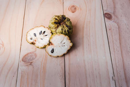 Sugar Apple (Annona squamosa L.) on wooden board, fruits of Thailand.の写真素材
