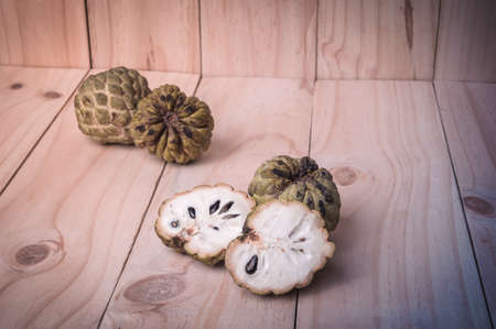 Sugar Apple (Annona squamosa L.) on wooden board, fruits of Thailand.の写真素材