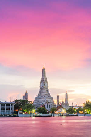 Wat Arun, along the Chao Phraya river  side with a colorful sky at  sunset in Bangkok,Thailand