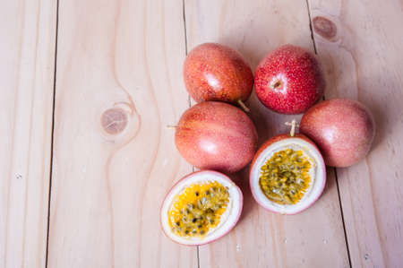Passion fruits on wooden background.  as package design elementの写真素材
