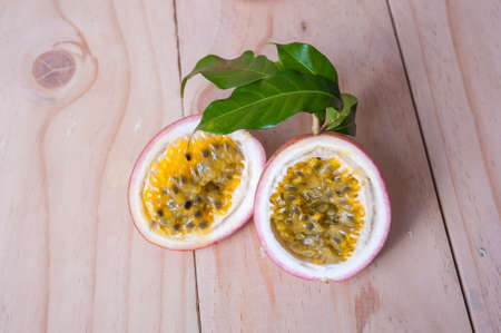 Passion fruits on wooden background.  as package design elementの写真素材