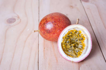Passion fruits on wooden background.  as package design elementの写真素材