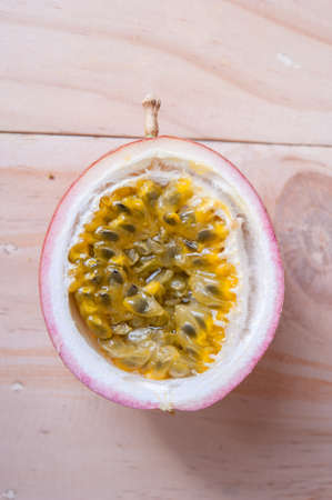 Passion fruits on wooden background.  as package design element