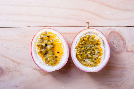Passion fruits on wooden background.  as package design elementの写真素材