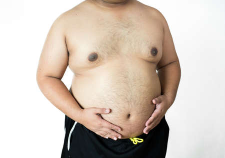Fat man ,overweight man with big belly on white background in studio.の写真素材
