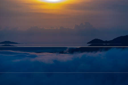 Beautiful dramatic sunset in the mountains. Landscape lot of fog Phu Thok Mountain at Chiang Khan...
