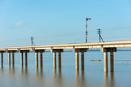 Landscape View of  Train crossing Pasak Chonlasit Dam. Reservoir for agriculture at Lopburi,Thailand