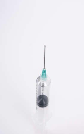 Empty medical syringe (needle) on white backgroundの写真素材