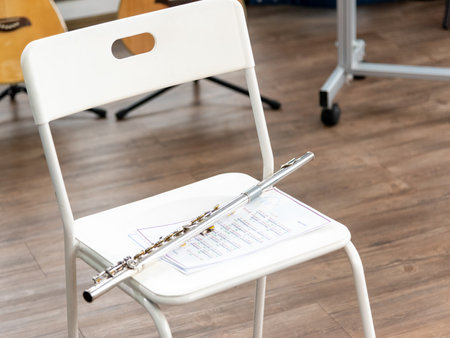 transverse flute on music sheet (classical musical instrument flute )の写真素材