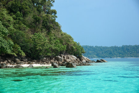 Beautiful Andaman sea, Tropical Turquoise clear blue sea and white sand beach on pattaya beach with blue sky background - summer vacation travel. at Tarutao national park and Koh Lipe in Satun, Thailandの写真素材