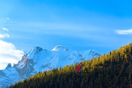 The last Shangri La, view of autumn highland snow mountain of Yading Nature Reserve, snow-capped mountains, crystal clear lakes, vast grasslands, colorful forests, Shangri-La Town, Daocheng, Sichuan, China.の写真素材